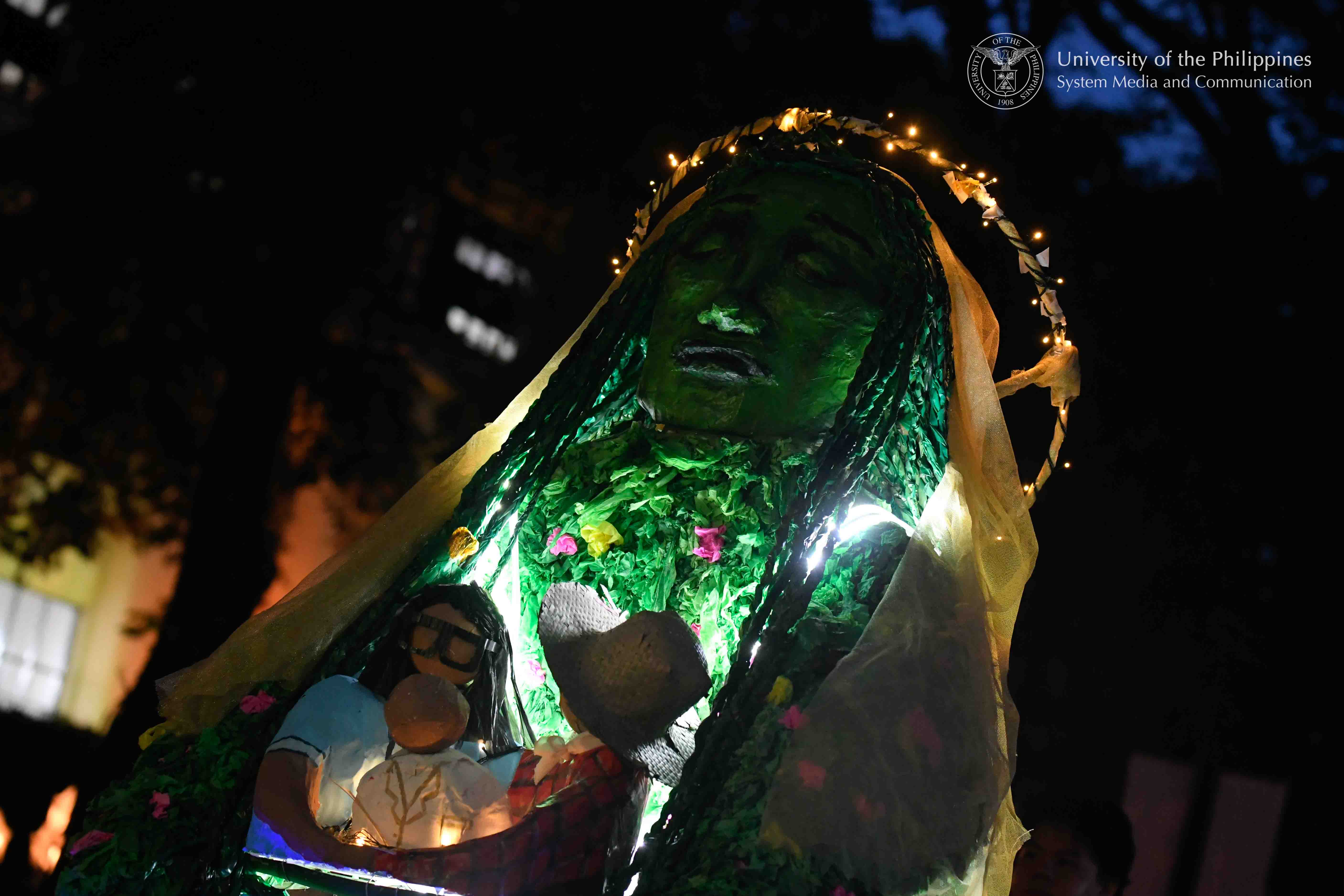 `The lantern of the UP Manila College of Medicine, which depicts the Sierra Madre as a maternal protector of the people, joins the Lantern Parade in UP Diliman. Photo by Kevin Roque, UPS-MCO.`